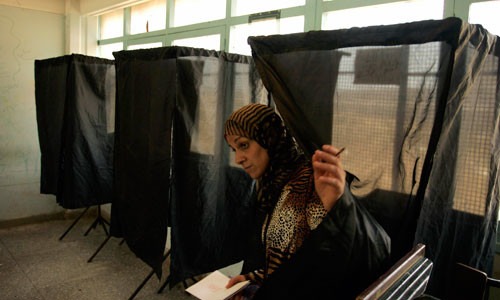 Woman leaves after voting at polling station during local elections in Sale. By Rafael Marchante/REUTERS